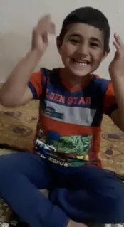 A young boy is having fun at home