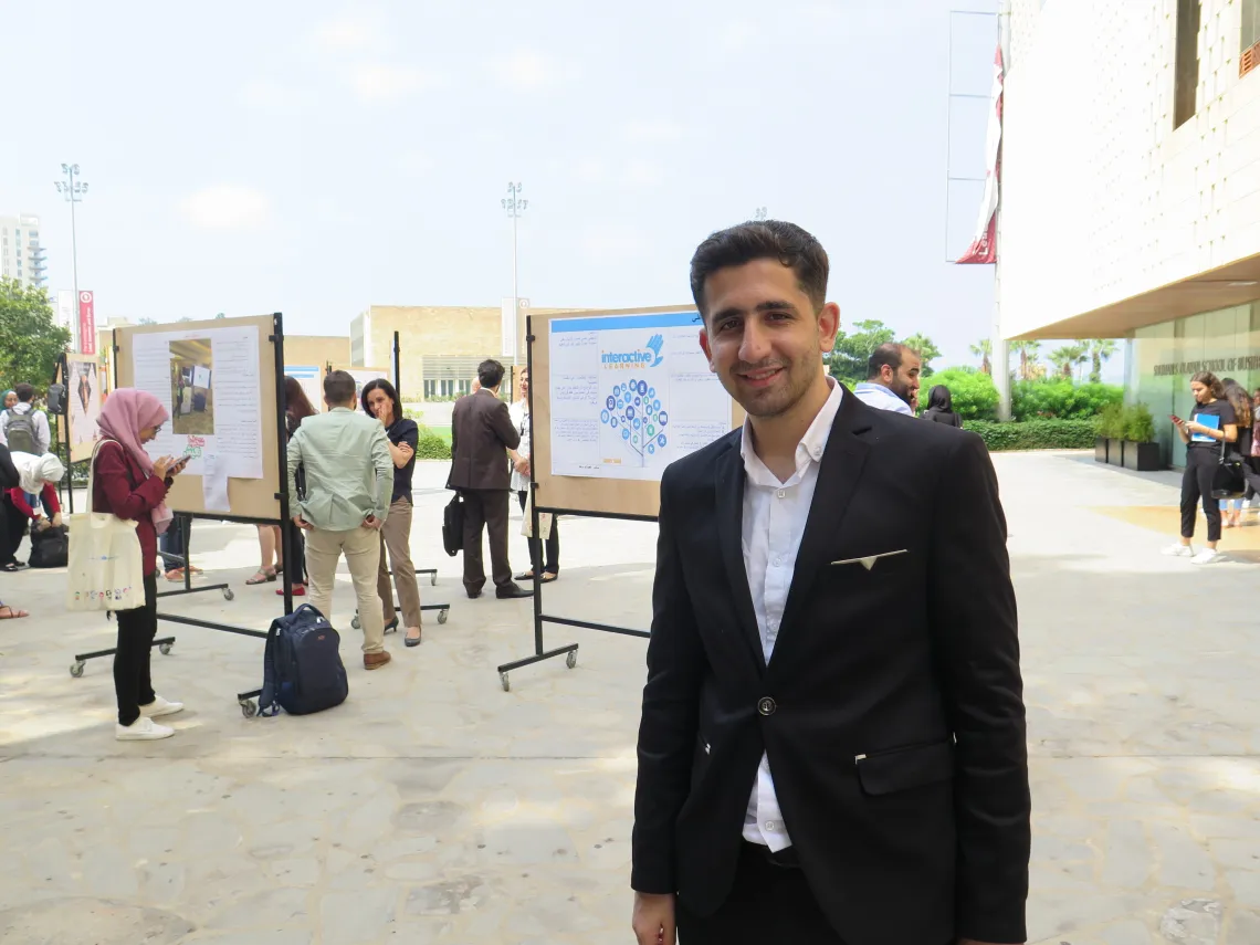 A guy dressed in a suit outside