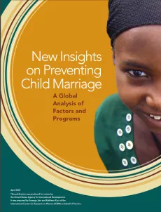 The cover shows half a picture of a young girl smiling. The rest of the design is a series of overlapping yellow and green circles. The background is green.