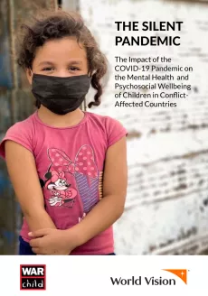 A young girl wearing a mask outside in Colombia