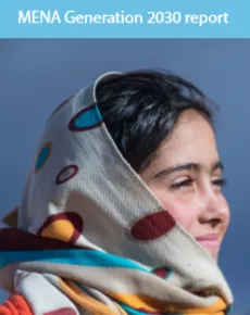 A young girl wearing a scarf smiling