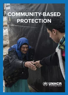 The cover shows a picture of a young man reaching out to grab an old woman's hand, in front of at tent. It is snowing.