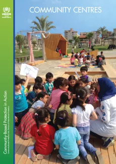 The cover shows a professor sitting with a group of children outside, on a outside playground. On the left corner, there is a vertical bar with the logo of UNHCR on the top left corner.