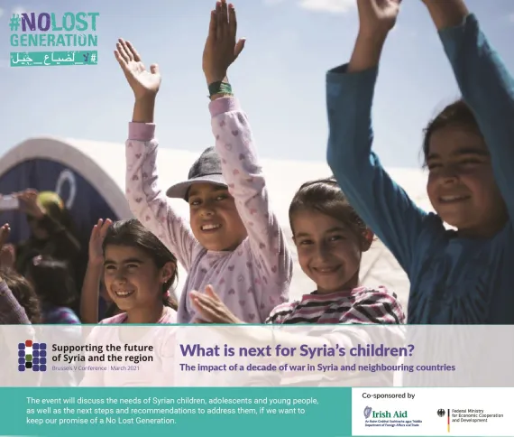 A row of children raising hands outside a camp